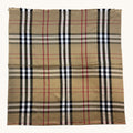 A square scarf featuring the classic vintage check plaid pattern in beige, black, white, and red, laid flat against a light off-white background.