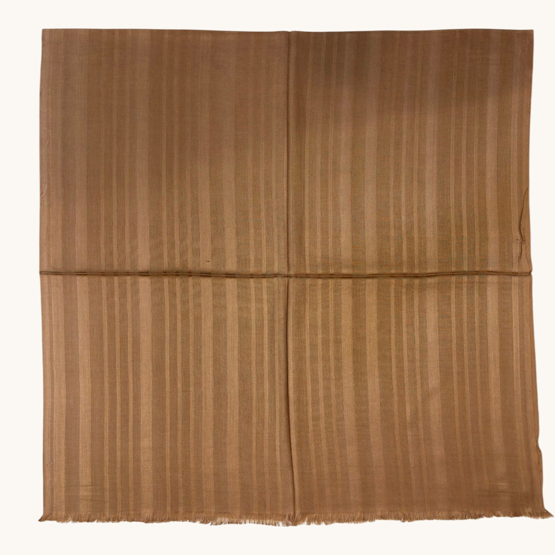 A square brown woven textile or mat with a subtle vertical striped texture, displayed flat against a plain white background.