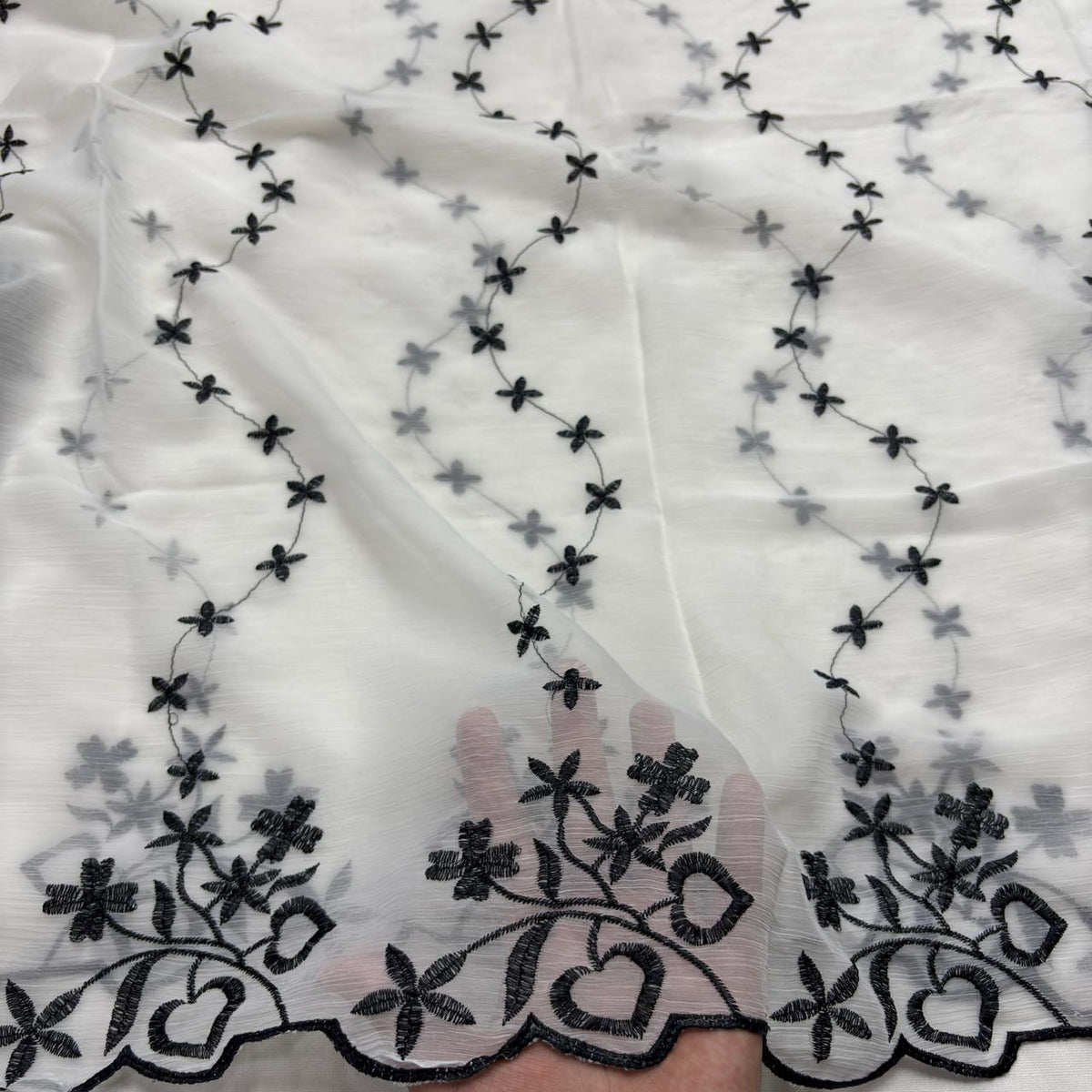 White chiffon dupatta with white leaf motifs and ornate scroll leaf border