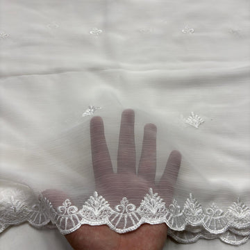 White chiffon dupatta with black embroidered four-petal flowers and scalloped medallion leaf border